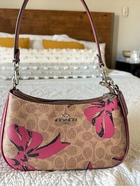 Coach Tan Signature Canvas Shoulder Bag with Pink Bow design